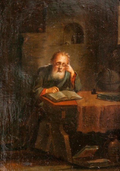 A scholar with his books and a globe